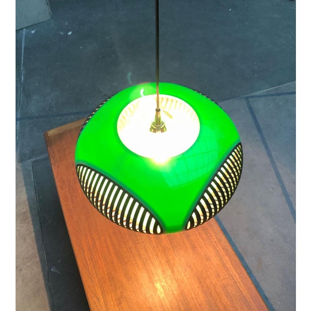 "Colani" ufo pendant lamp. Striking lamp from the 1970s in a shape and color characteristic for the time. An impressive...