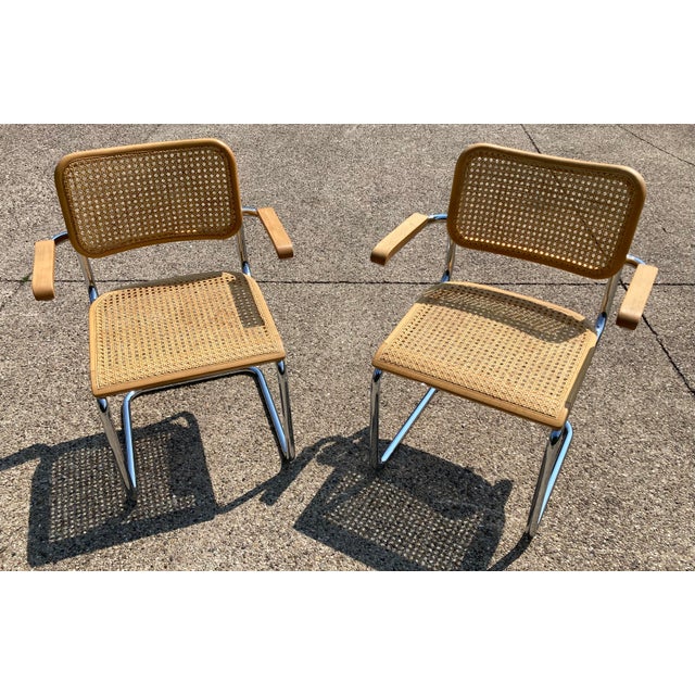 Produced by Gościcińskie Fabryki Mebli (GFM), this pair of chairs echo the cantilever tubing and caning details of the...