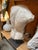Striking classical-style male torso sculpture inspired by ancient Greco-Roman art. Crafted in a textured stone or plaster...