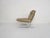 High quality chromed metal lounge chair with an off-white / beige leather upholstery. We think they are designed by Paul...