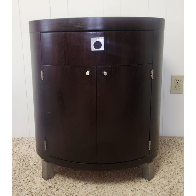 elegant oval night stand or end table designed by Michael Weiss and made by Vanguard Furniture, dark espresso finish over...