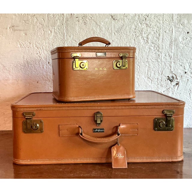 Capture the romance and glamour of the golden age of travel with this impeccable vintage luggage set by Amelia Earhart....