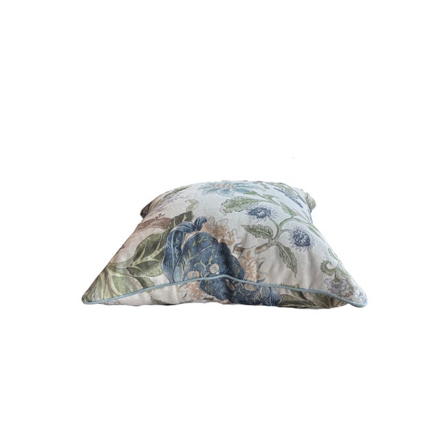This high-end designer fabric pillow in a botanical floral linen print, adds timeless elegance to any space. Trimmed with...
