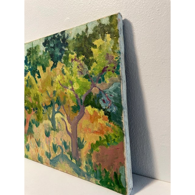 This vintage painting on stretched canvas features impressionistic brush strokes suggesting trees and foliage in brilliant...