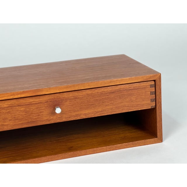 Teak wall console, model 127, by Kai Kristiansen for Aksel Kjersgaard - Denmark, 1960s. Original brushed aluminum handle....