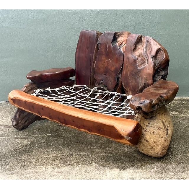 This monumental redwood slab sofa is a tour de force of organic modernism, masterfully executed in the tradition of the...