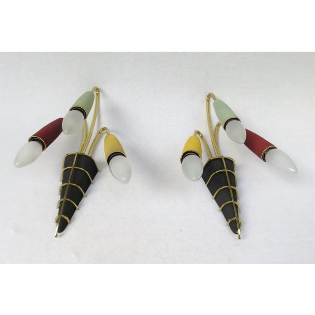 A pair of extraordinary wall lights, manufactured in Germany in the 1950s. A must for fans of 50s design. They are...