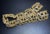 This vintage mid-century modern Trifari bracelet showcases a bold Brutalist design, featuring articulated openwork links...