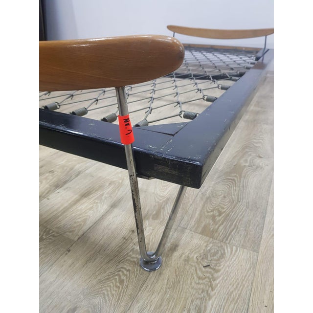 A beautiful daybed made in Switzerland by Fred Ruf, designed in the 1950s for Wohnbedarf AG Switzerland. Black solid teak...