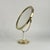 This elegant, minimalist tabletop vanity mirror was designed and manufactured in Sweden in the 1960s. It features a brass...