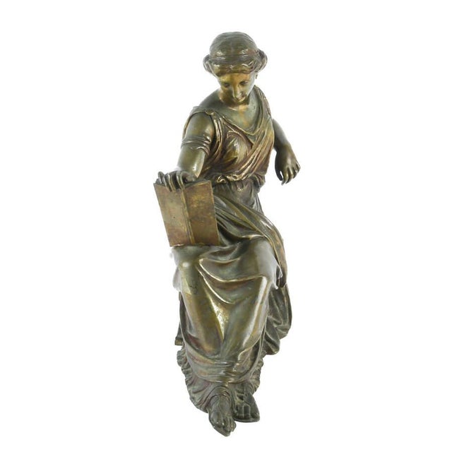 This Antique Classical Bronze “Woman Reading Plato” Sculpture, modeled after Jean‑Jacques Pradier, is a refined example of...