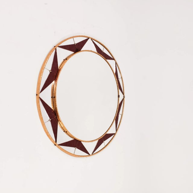 Spanish circular mirror with glass mosaic, 1960s. Frame formed by textured artistic glass tiles as an iridescent purple-...