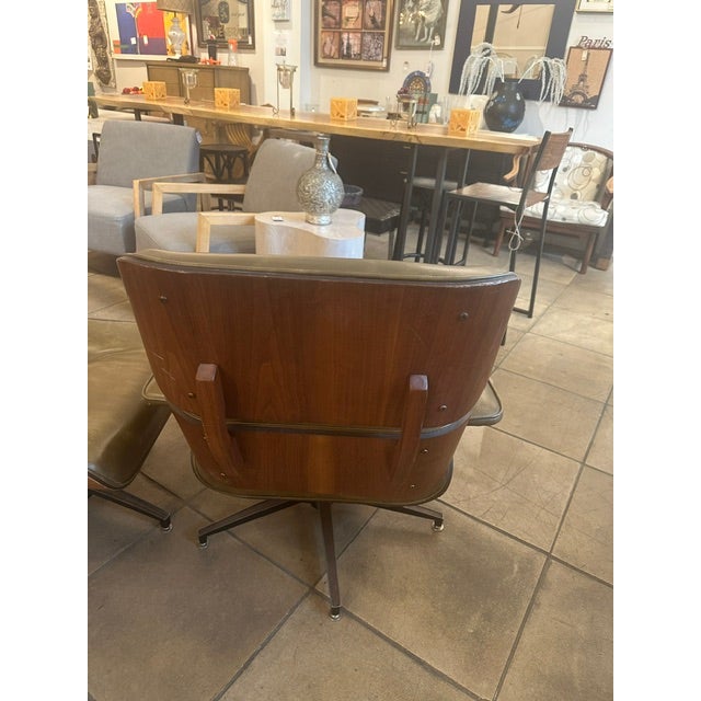 MCM Eames Style Lounge Chair & Ottoman in Olive. Has the perfect worn leather with character that is desired in an Eames...