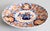 A striking 19th century antique Imari plate with a scalloped edge. Featuring vibrant oranges, blues, and green. The multi-...