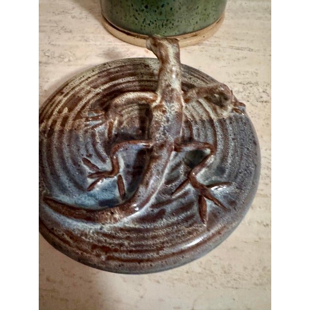 Really fun mid-century studio pottery vessel with the best sculptural lizard stretched across the lid. That little guy...