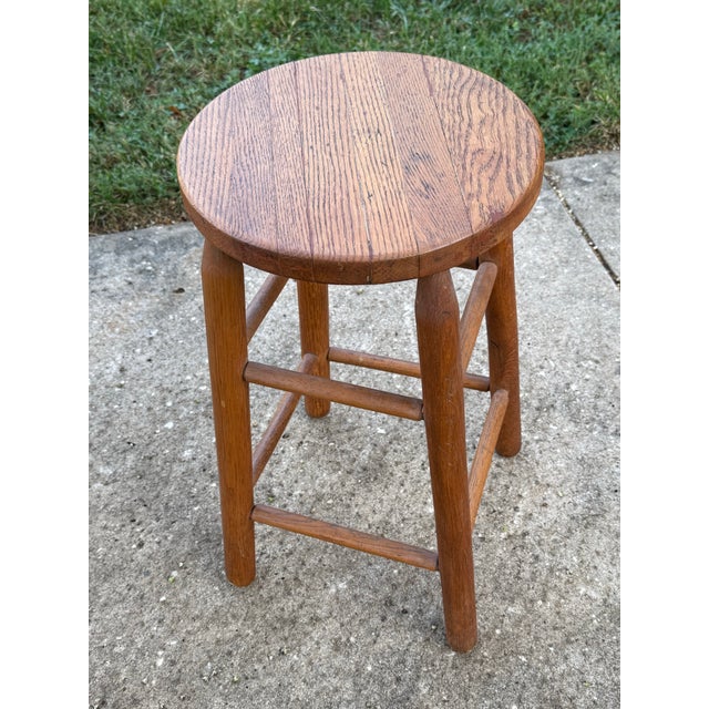 Midcentury rustic wooden counter-height stool. Beautiful tone and age to the oak. Bench-made piece. Please see condition...