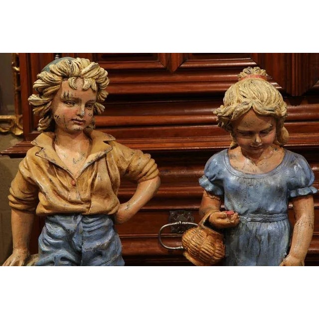French Provincial Pair of Mid-Century French Painted Iron Garden Statues of Children Sculptures For Sale - Image 3 of 7