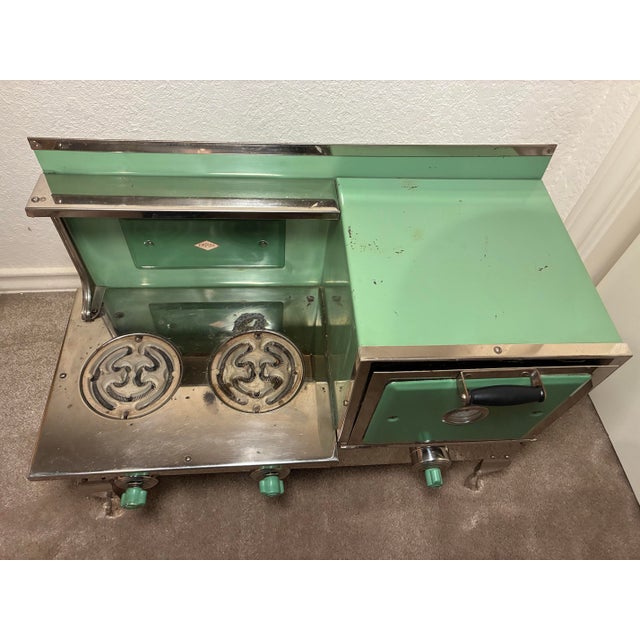 This remarkable Empire kitchenette toy by Metal Ware is from the 1920’s. It is all original with no restoration work. Due...