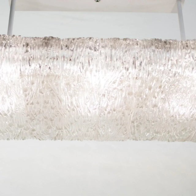 Chandelier composed of 14 textured glass slabs, solid brass end covers and steel frame. Origin: Italy Circa: 1950s...