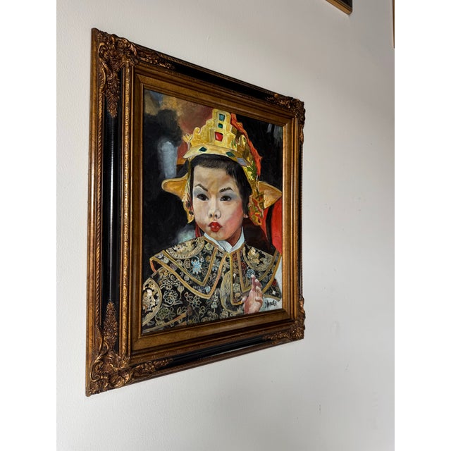 Striking vintage oil on canvas portrait depicting a young Japanese girl in elaborate traditional ceremonial attire, signed...