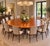 An exceptional monumental antique mahogany and yew wood crossbanded circular centre dining table dating to circa 1920,...