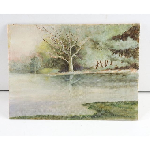 Small celadon tonal oil on canvas board riverside landscape painting. Unsigned. Unframed.