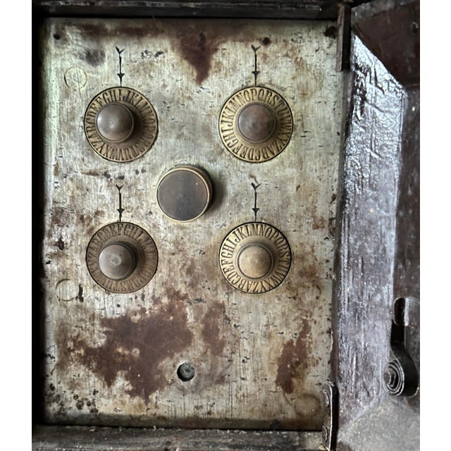 A relic of a bygone era, antique vault-style cabinet commands attention with its imposing presence. Its heavy, dark wood...