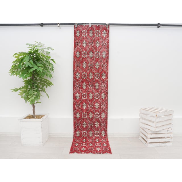Bring bold elegance and classic Anatolian charm into your home with this stunning vintage Turkish runner rug. Hand-knotted...