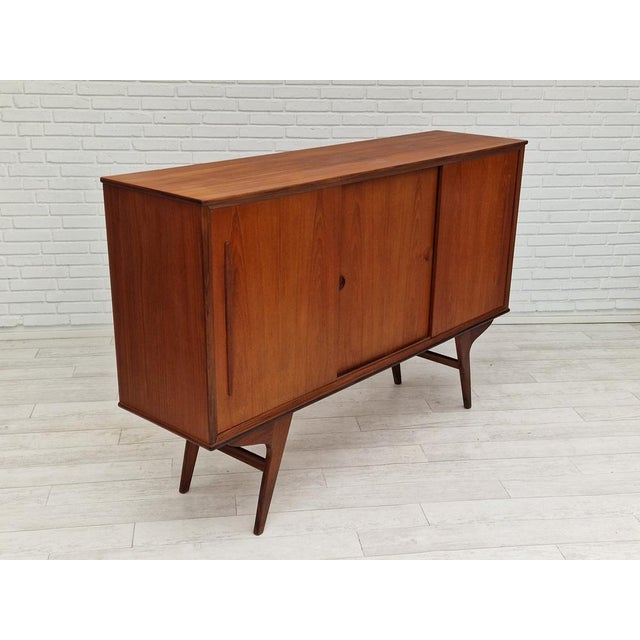 Vintage Danishcabinet-chest, teak wood. Sliding doors, drawers, mirror inside. No smells, no stains. Very good condition.