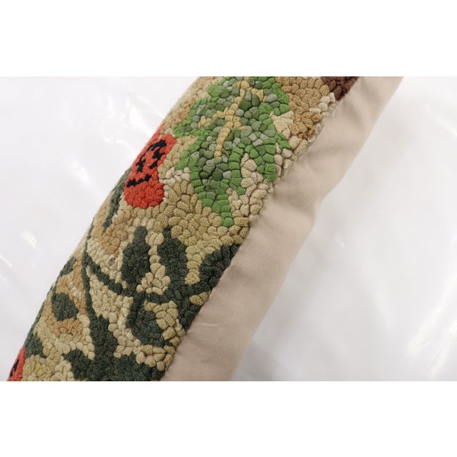 Pillow made from a colorful 20th-century floral American hooked rug Measures: 11" x 16".