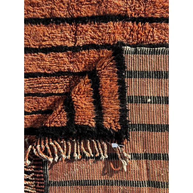 This authentic Mrirt Moroccan rug is a handwoven wool carpet crafted in the Middle Atlas Mountains of Morocco by skilled...