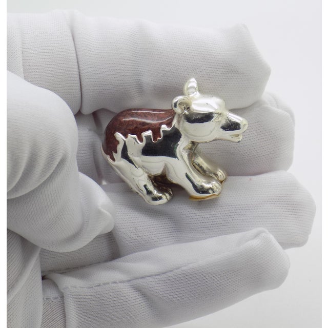 A charming wildlife miniature for a curio cabinet or silver collection, this vintage bear cub figurine was handcrafted in...