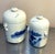 Hand-painted blue/white ceramic lidded asian canisters/jars; set of two. Some mild discoloration spots on one side of one...