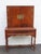 This brilliant China Cabinet is made of wood, rosewood, flame mahogany, veneer, and brass. The Cabinet has Chippendale...