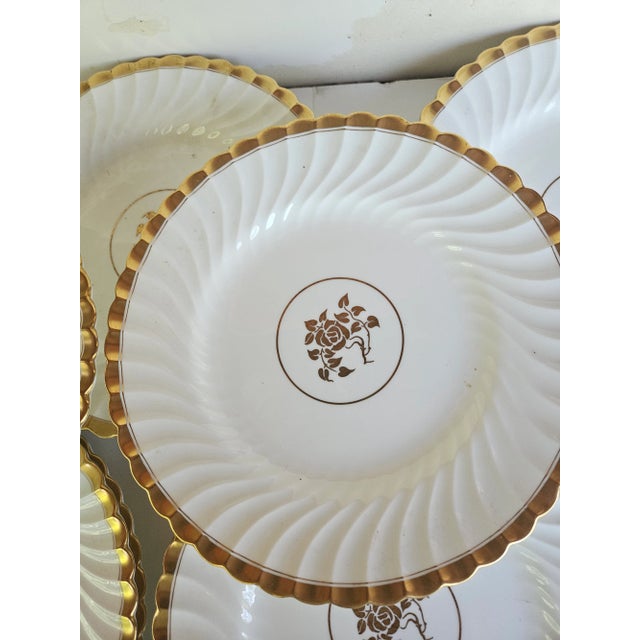 One Dozen Elegant Porcelain 9 inch Mintons Plates, Fluted and 22k Gold edge, with a gold rose in the center. Beautiful...