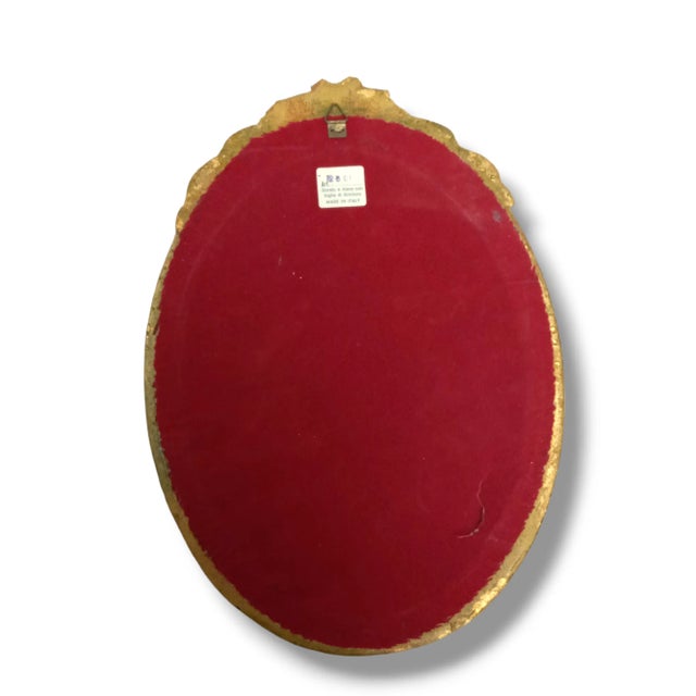 Beautiful antique mirror in a giltwood frame from Italy. Measures approximately 14" tall and 7" wide. Item is in good...