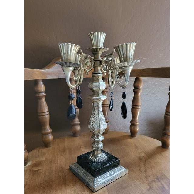 Elevate your space with this striking vintage Dilly MFG. Co. four-arm candelabra. Perfectly balancing industrial edge with...