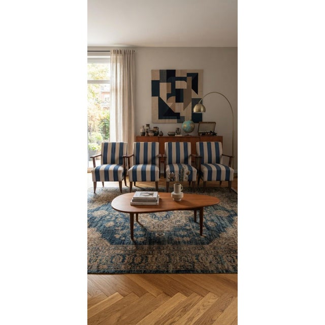 An exceptionally rare and stunning matching set of 4 fully refurbished vintage retro lounge armchairs, featuring rich...