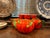 A playful tea set comprised of one teapot, one sugar pot, one creamer jug, and three small cups; each piece resembles an...