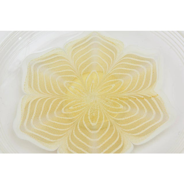 This 1980's vintage Italian Murano pedestal glass bowl or low dish is white with gold aventurine flower design in the...