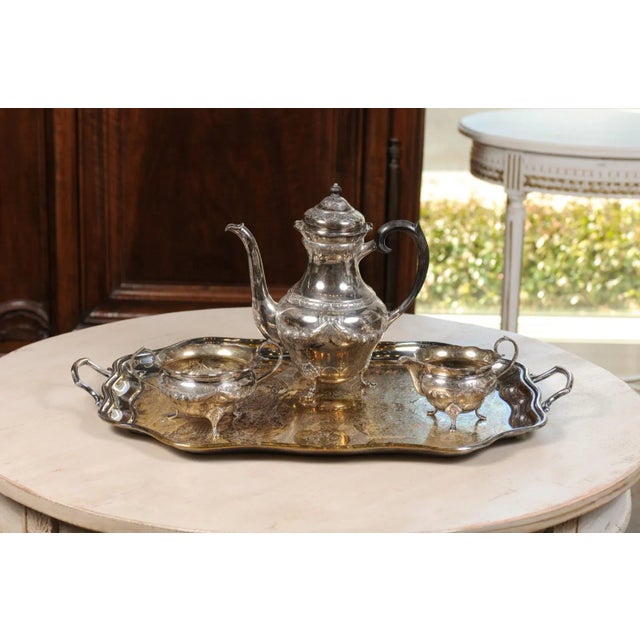 A three-piece Danish silver coffee set from the mid 20th century, with ebony handle by Johannes Siggaard. Born in Denmark...