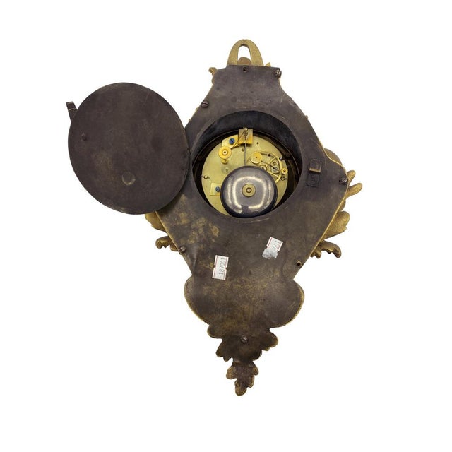 French Gilt-Bronze Cartel Clock, Signed Navet à Versailles — Mid-19th Century An elegant gilt-bronze cartel clock, signed...