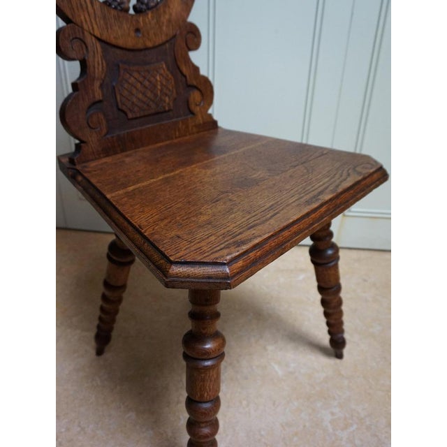 Swiss Black Forest hand carved Oak Side Chair with standing Lion, around 1880 The backrest is made in hand carved open...