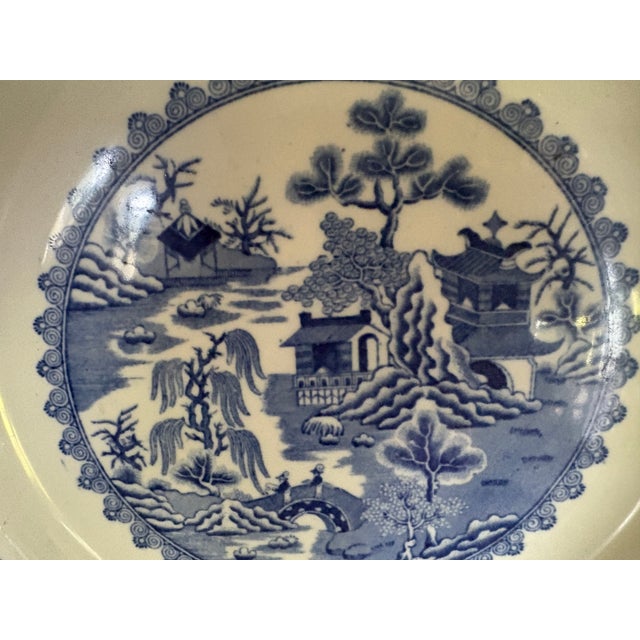 A Mason's Blue Willow pattern ironstone transfer ware plate made in the early 19th C. The plate measures 11.5" in diameter...