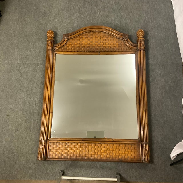 This is a large Boho Chic Coastal Faux Wicker-Bamboo Wall Mirror from the 1970s. It features two large cylinder shaped...