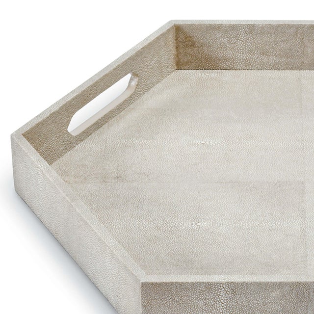 Wrapped in a light grey faux shagreen, this hexagonal tray will meet your serving or display needs. Also available in two...