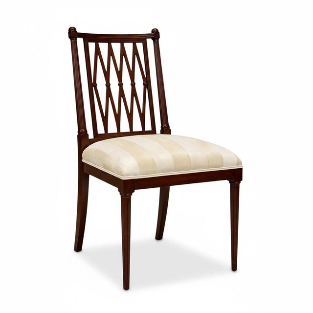 This is a handsome set of Georgian style carved mahogany dining set. The upholstery is vintage and is a cut velvet. It...