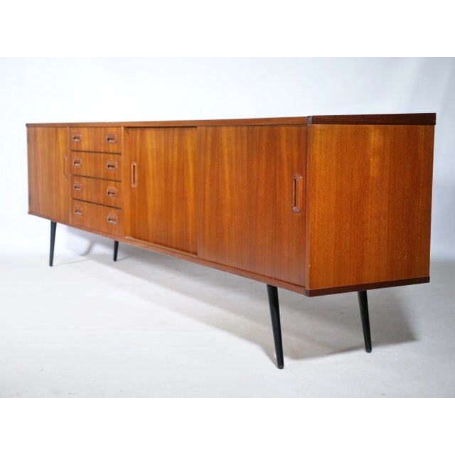 Large teak sideboard from Musterring. Rare design classic made from high-quality materials. Width: 242cm Height: 73cm...