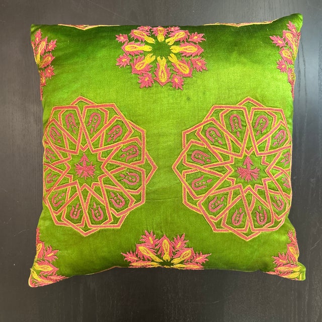 Gorgeous hand embroidered silk Suzani pillow with reverse Ikat design. The workmanship is fantastic and has been passed...