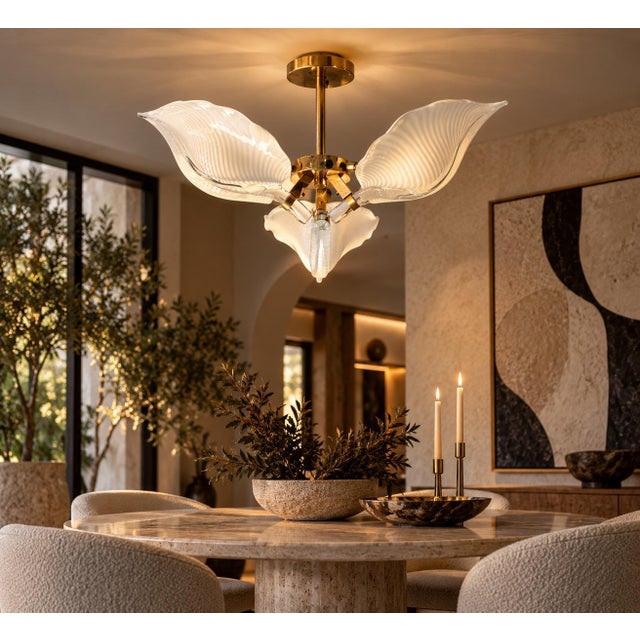 Striking 1970s Italian chandelier attributed to Franco Luce, featuring three sculptural handblown Murano glass shades...